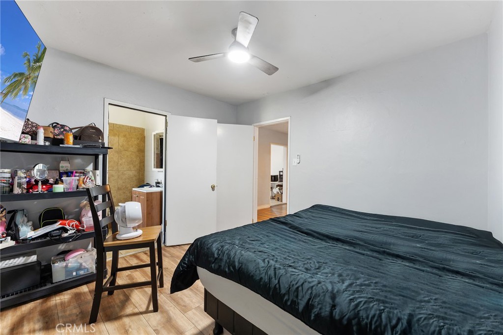 491 East C Street Colton, CA 92324 - Photo 32 of 58 a bedroom with a bed and a window