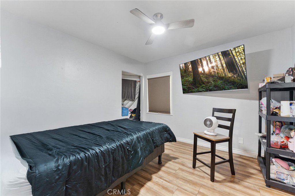 491 East C Street Colton, CA 92324 - Photo 33 of 58 a bedroom with a bed and a flat screen tv