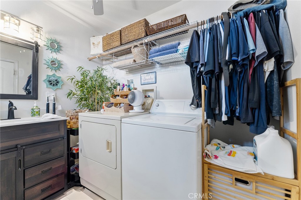 491 East C Street Colton, CA 92324 - Photo 34 of 58 a view of walk in closet with clothes and shoes