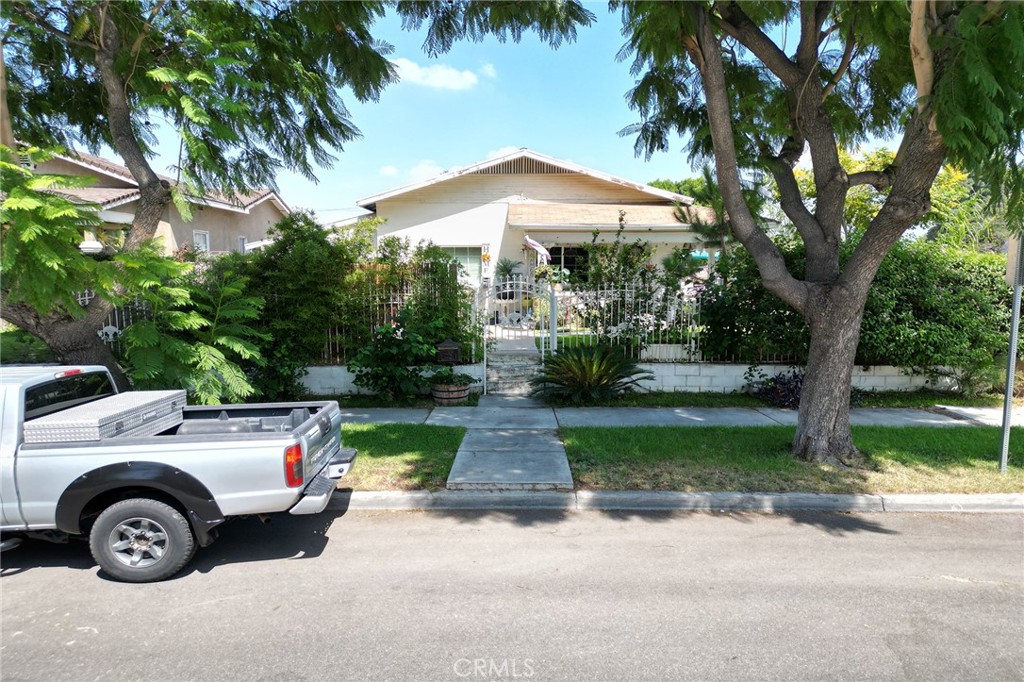 491 East C Street Colton, CA 92324 - Photo 41 of 58 a front view of a house with garden