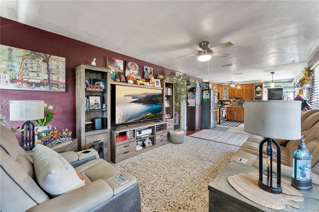 491 East C Street Colton, CA 92324 - Photo 45 of 58 a living room with furniture and a flat screen tv