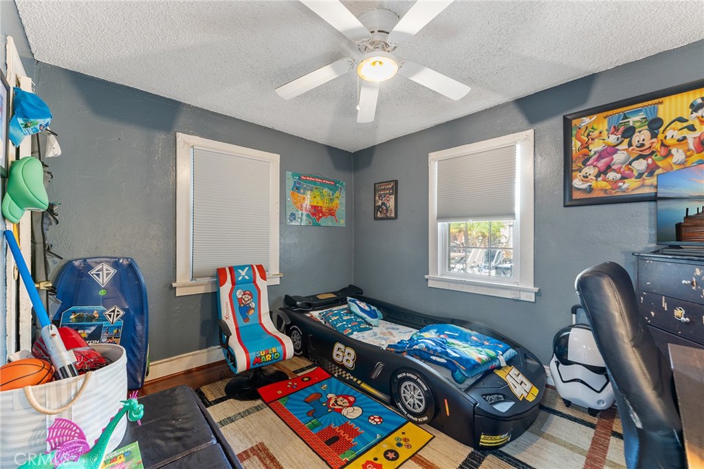 491 East C Street Colton, CA 92324 - Photo 48 of 58 a bed room with furniture and a window