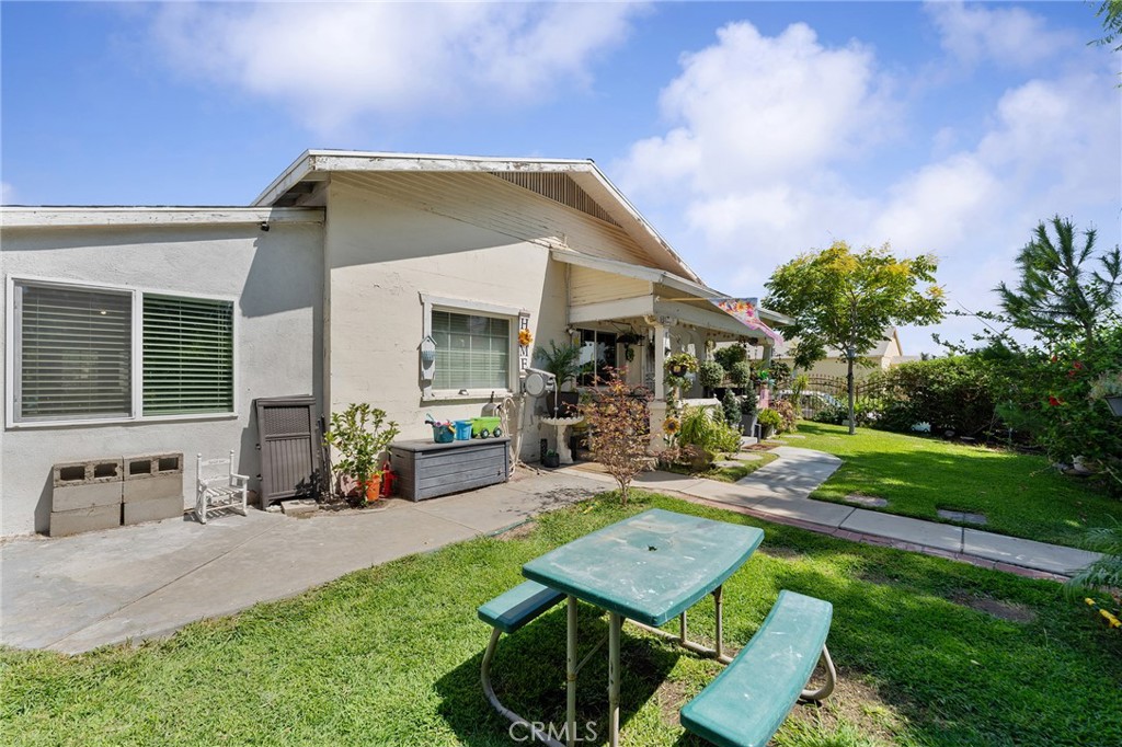 491 East C Street Colton, CA 92324 - Photo 10 of 58 a backyard of a house with table and chairs