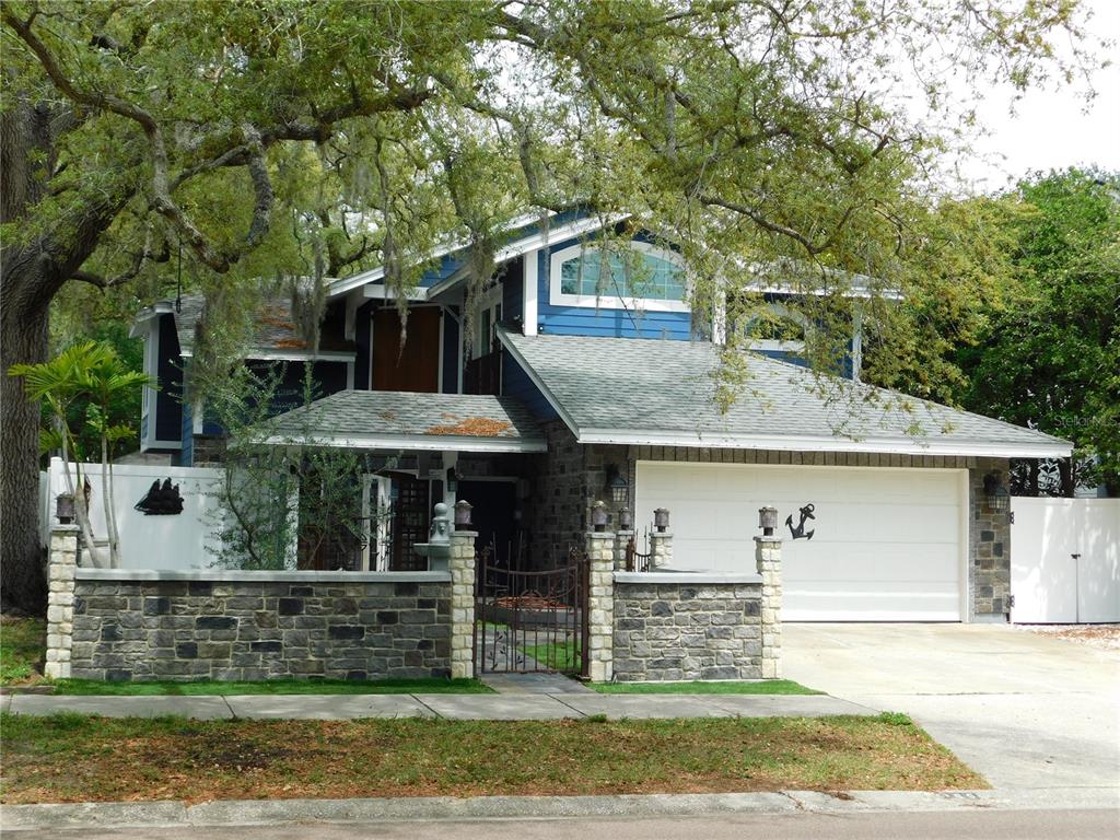 155 Marshall Street Safety Harbor, FL 34695 - Photo 1 of 62 a front view of a house with garden