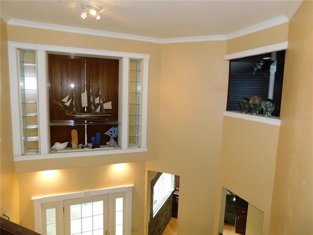 155 Marshall Street Safety Harbor, FL 34695 - Photo 30 of 62 a view of a hallway with wooden floor and dining room
