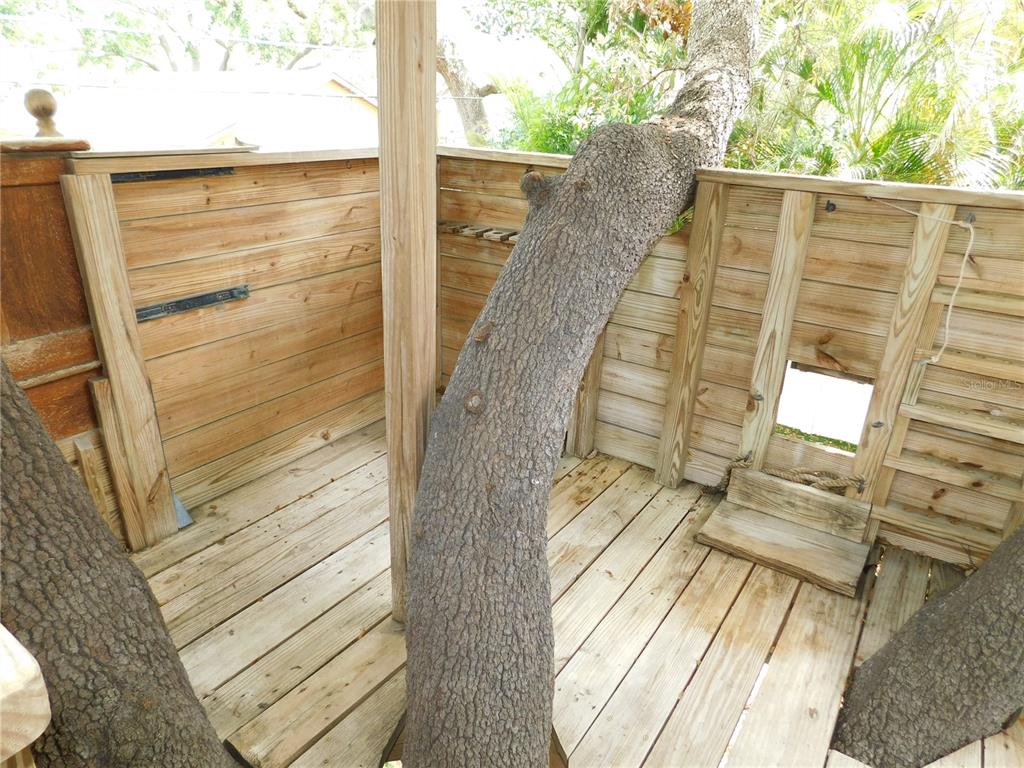 155 Marshall Street Safety Harbor, FL 34695 - Photo 44 of 62 a view of a balcony with wooden floor and fence