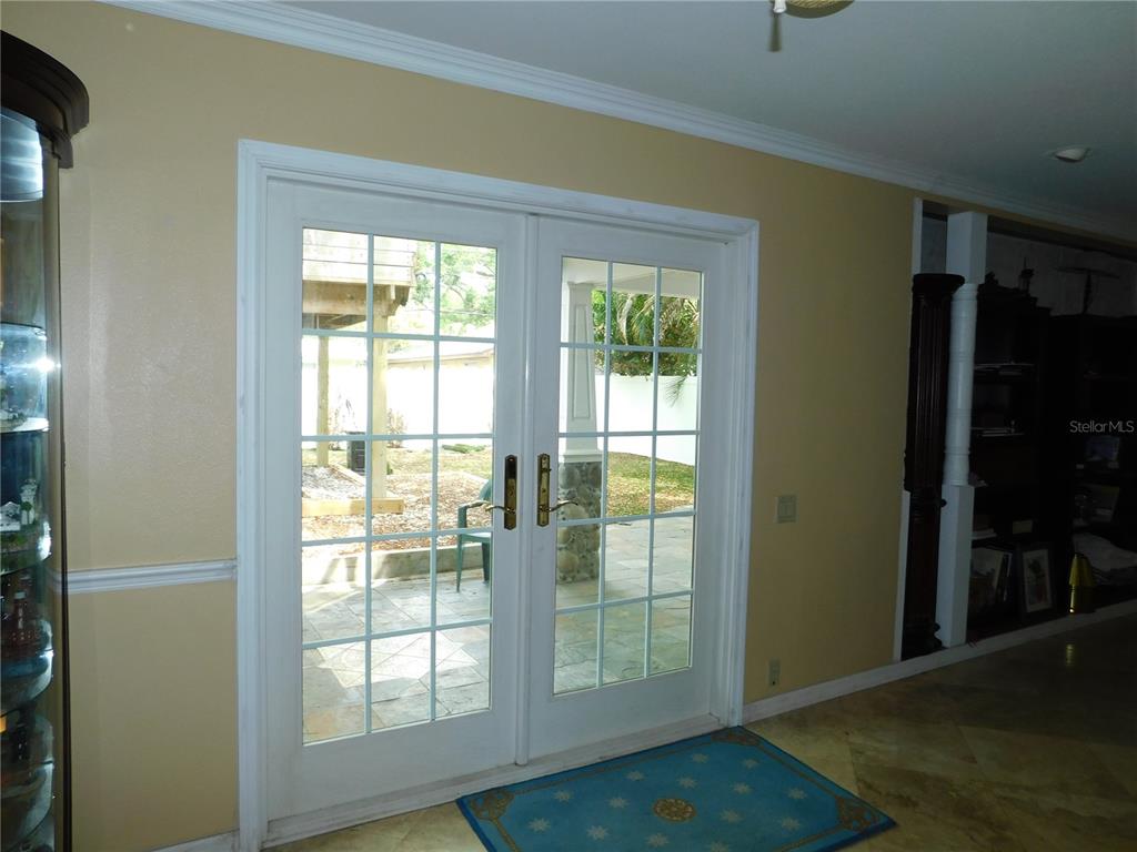 155 Marshall Street Safety Harbor, FL 34695 - Photo 10 of 62 a view of an empty room with wooden floor and a window