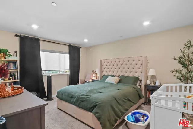 a bedroom with a bed and a table