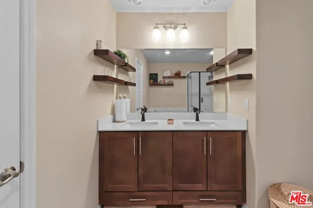 a kitchen with kitchen island a sink stainless steel appliances and cabinets