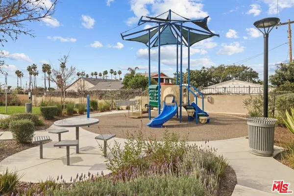 a view of a lake with a table and chairs