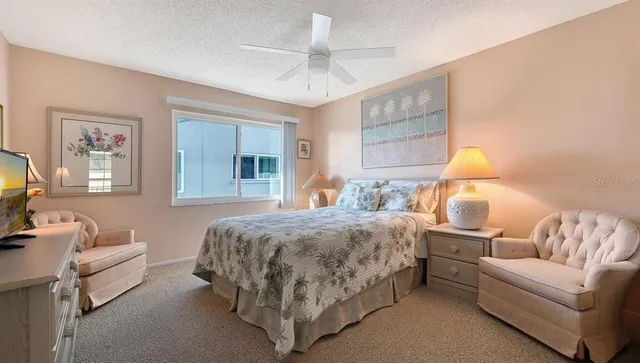 a bedroom with a bed and a couch