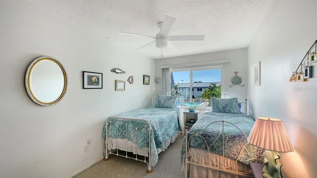 a living room with a bed furniture and a window