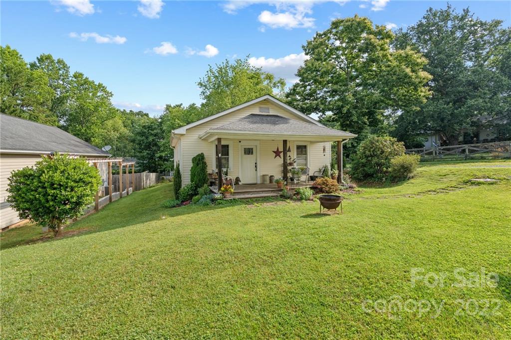 136 Round Top Road Asheville, NC 28803 - Photo 2 of 34 a view of a house with backyard and sitting area