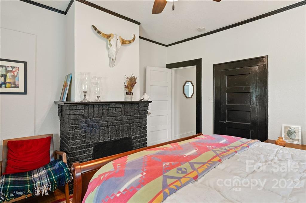 136 Round Top Road Asheville, NC 28803 - Photo 22 of 34 a bedroom with a bed and a dresser