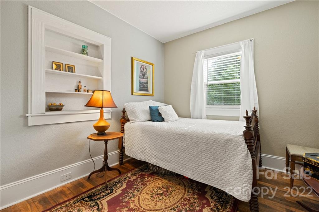 136 Round Top Road Asheville, NC 28803 - Photo 25 of 34 a bed room with a bed and a window