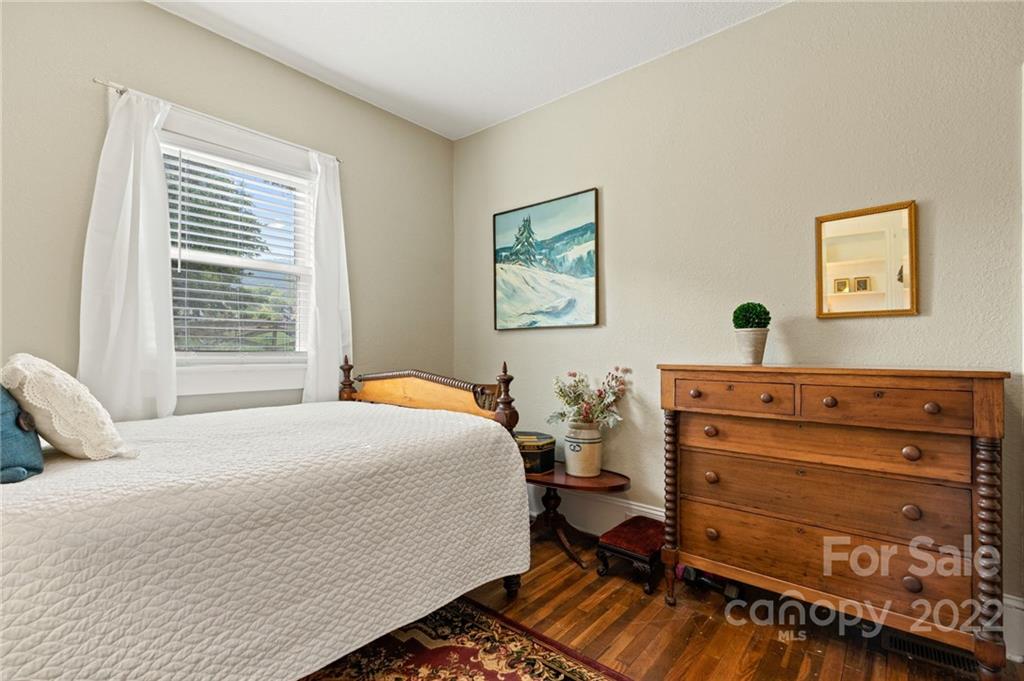 136 Round Top Road Asheville, NC 28803 - Photo 26 of 34 a bedroom with a bed and a dresser