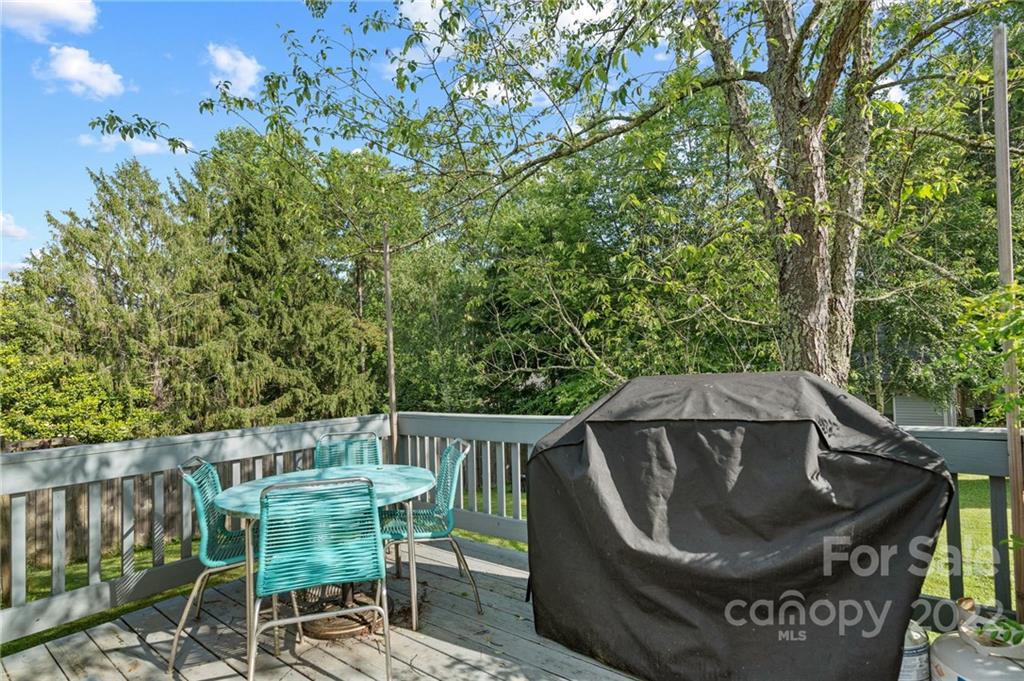 136 Round Top Road Asheville, NC 28803 - Photo 29 of 34 a view of balcony with wooden floor and outdoor seating