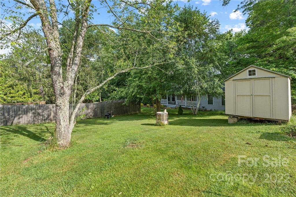 136 Round Top Road Asheville, NC 28803 - Photo 30 of 34 a view of a backyard with a garden and entertaining space