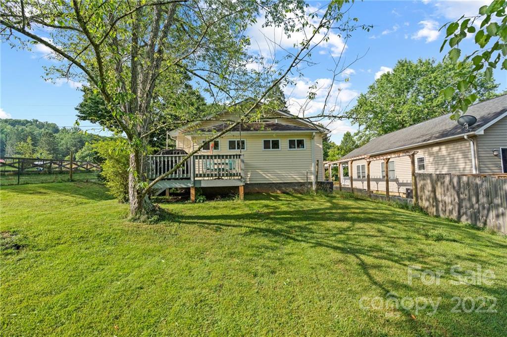 136 Round Top Road Asheville, NC 28803 - Photo 32 of 34 a view of a house with a yard