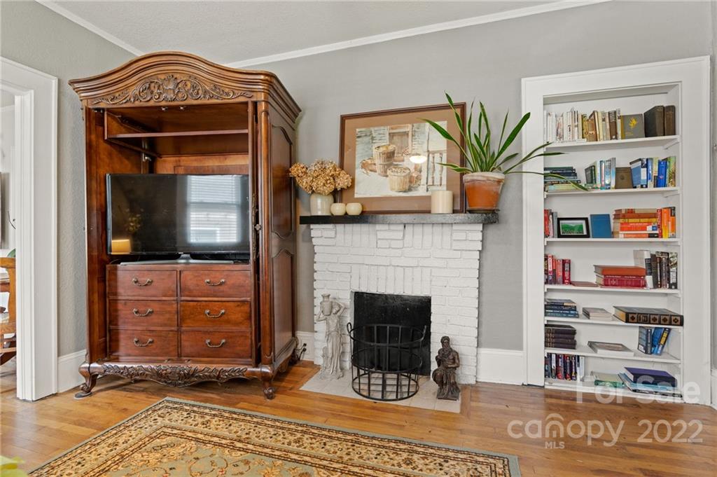 136 Round Top Road Asheville, NC 28803 - Photo 10 of 34 a living room with furniture and a fireplace