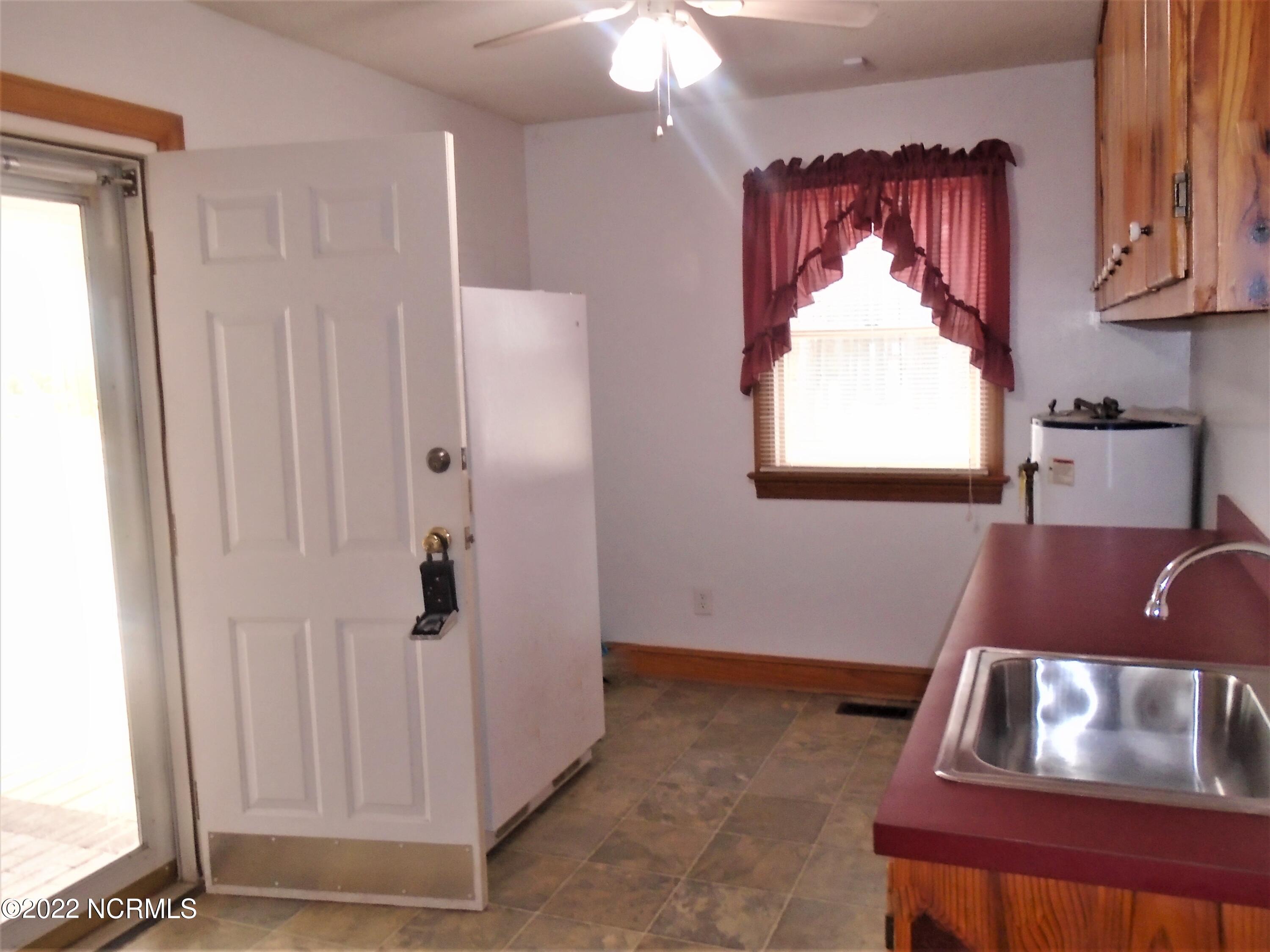 222 Brake Road Rocky Mount, NC 27801 - Photo 15 of 39 Huge drop zone with cabinets, sink and laundry hookups