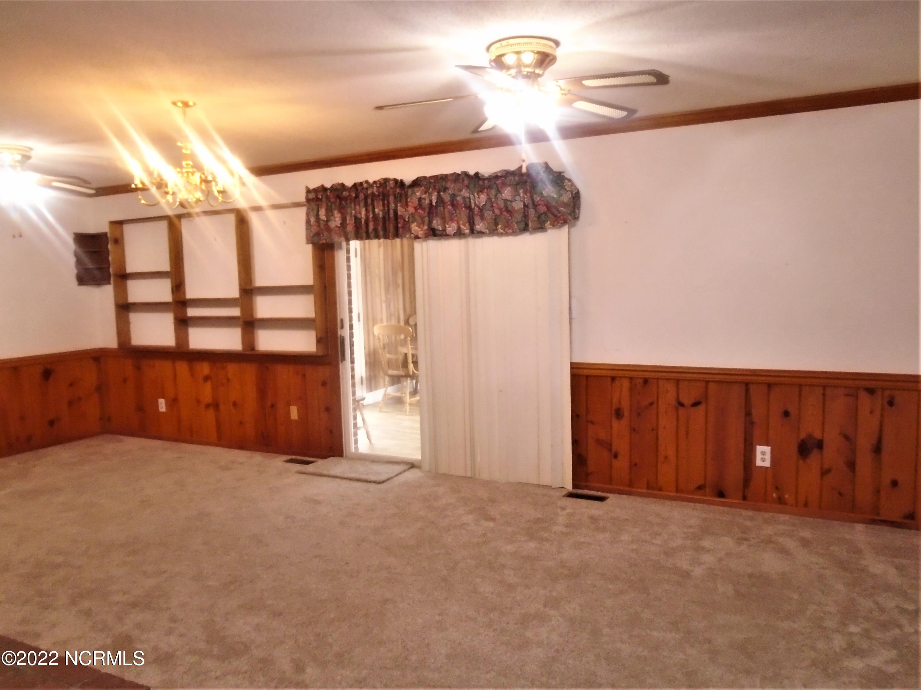 222 Brake Road Rocky Mount, NC 27801 - Photo 20 of 39 Large den with sliding glass doors to a sun room