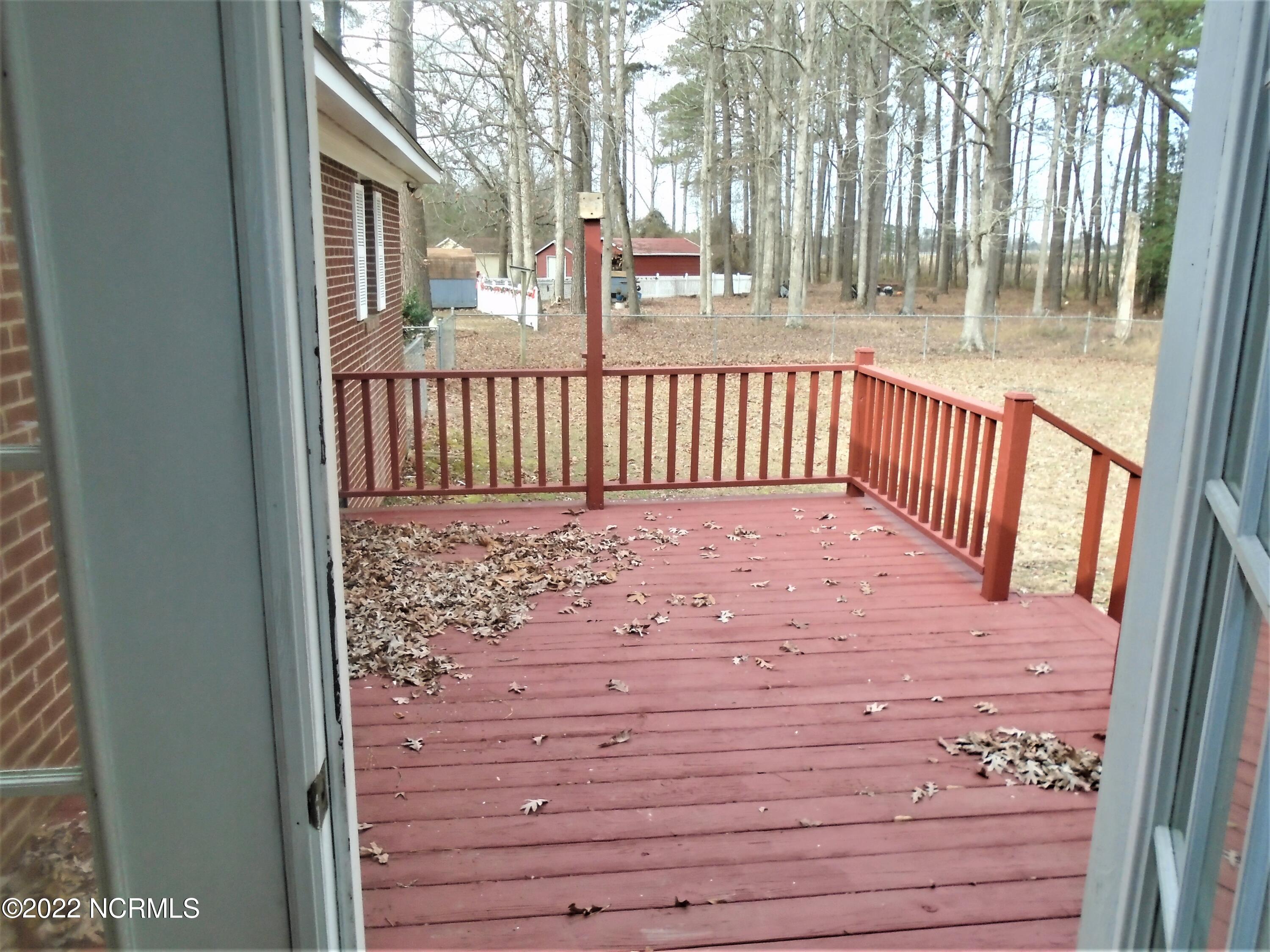 222 Brake Road Rocky Mount, NC 27801 - Photo 25 of 39 Rear deck off the sunroom