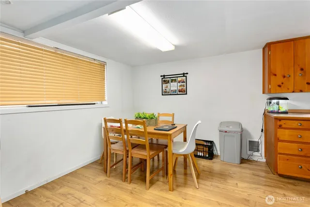 a view of a dining room with furniture and a window