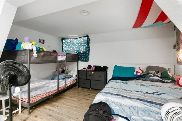 a bedroom with two beds and a couch