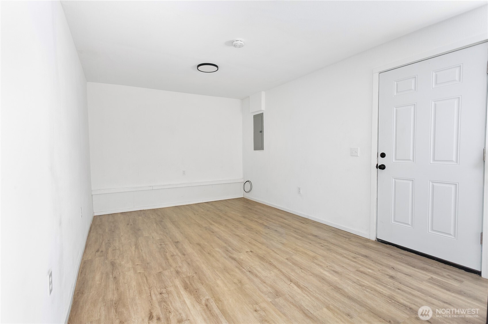 2205 South Meridian Puyallup, WA 98372 - Photo 31 of 39 a view of an empty room with wooden floor