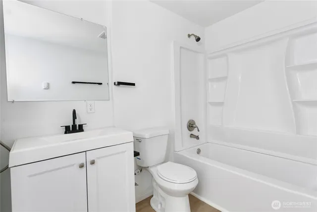 a bathroom with a sink a toilet and a bathtub