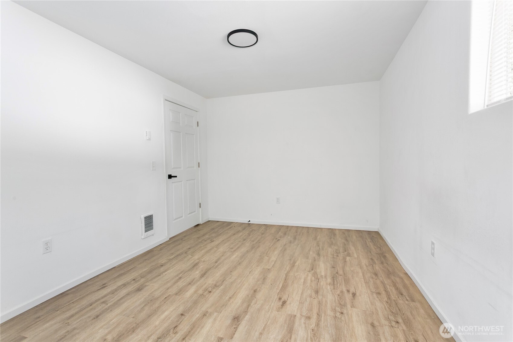 2205 South Meridian Puyallup, WA 98372 - Photo 36 of 39 a view of room with hardwood floor and window