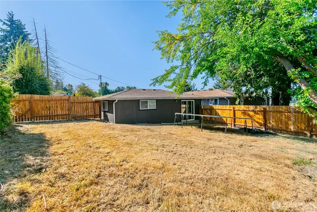 a house with trees in the background