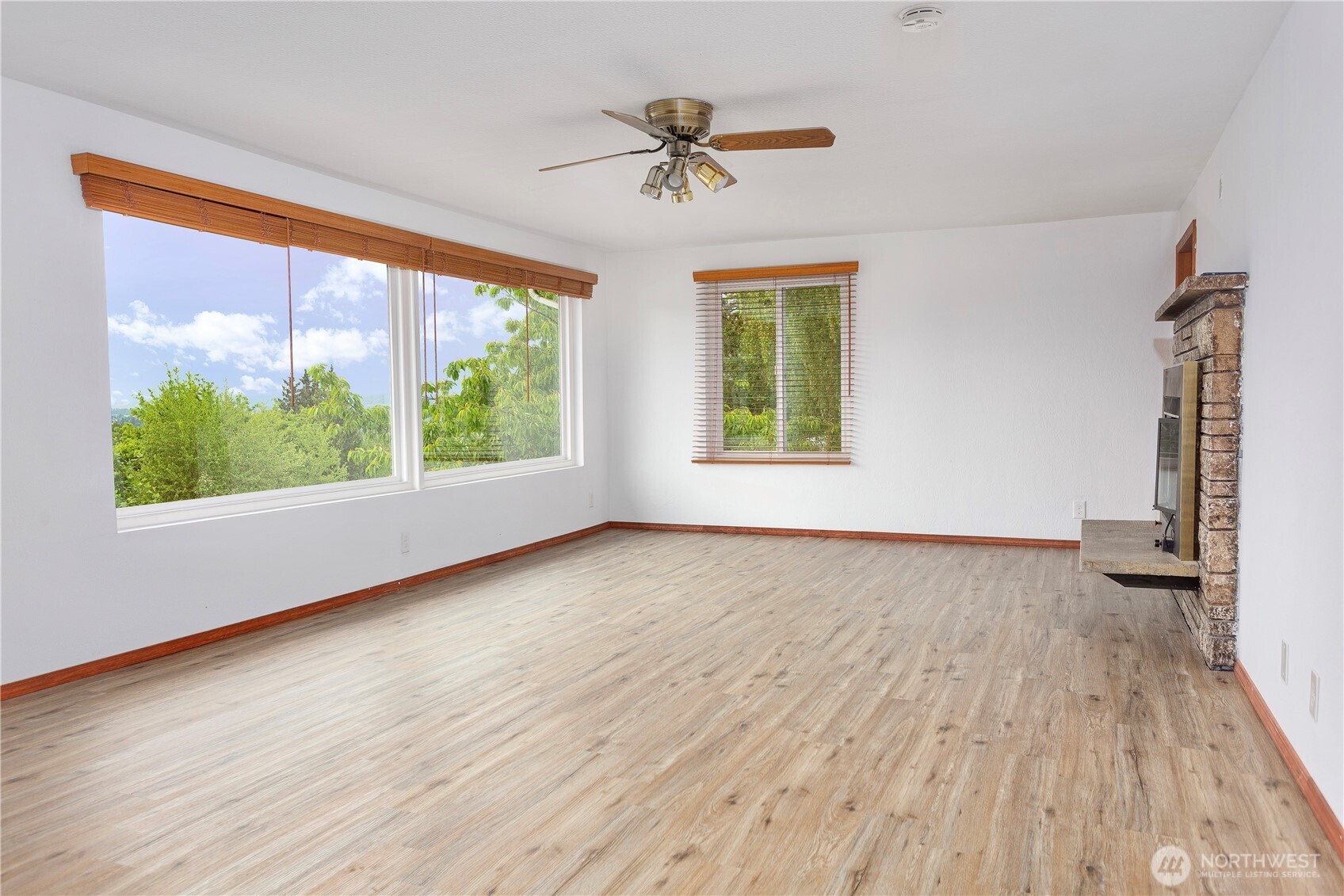 2205 South Meridian Puyallup, WA 98372 - Photo 10 of 39 wooden floor in an empty room with a window