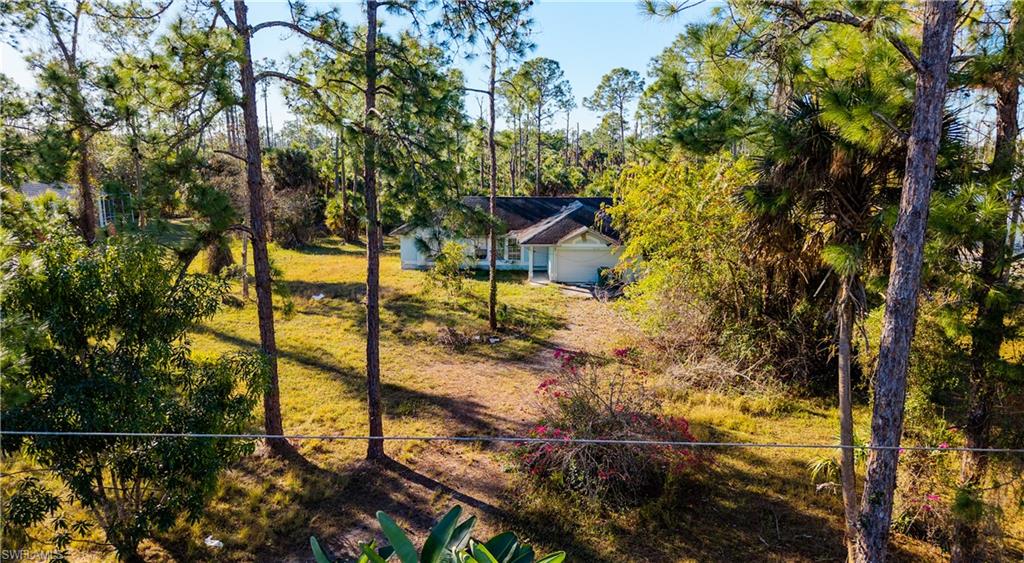 3330 12th Avenue Southeast Naples, FL 34117 - Photo 4 of 9 a view of a pathway of a house