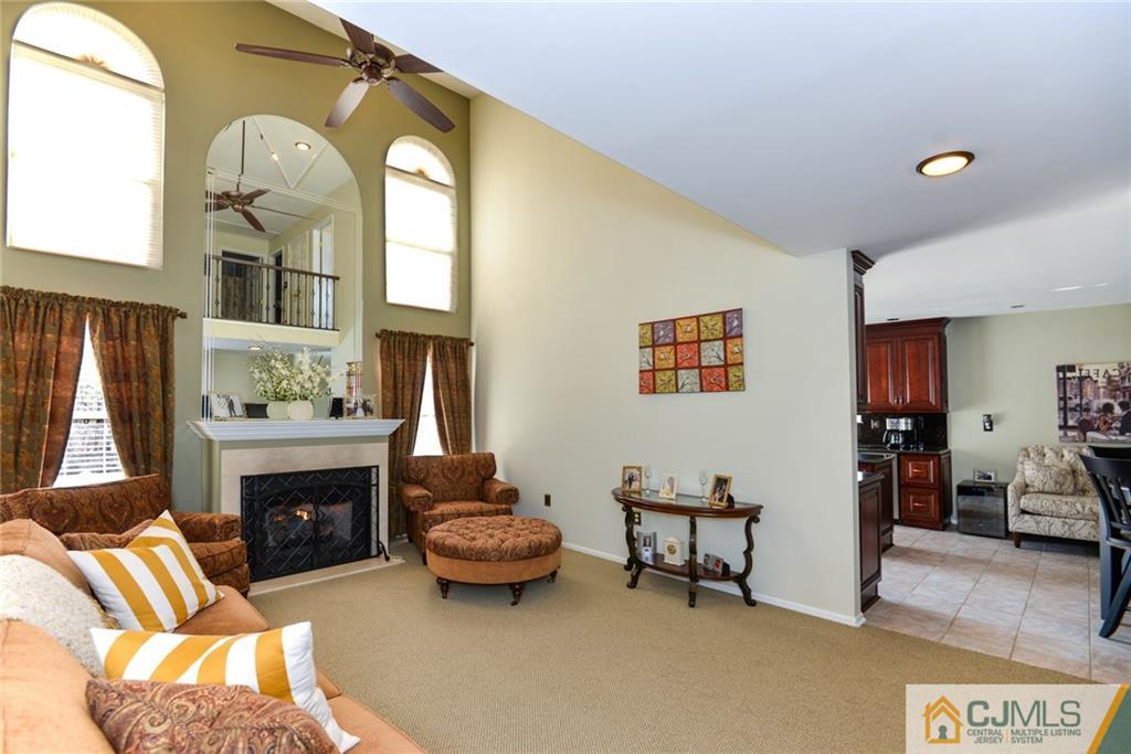 135 Disbrow Road Old Bridge, NJ 07747 - Photo 14 of 25 a living room with furniture and a fireplace