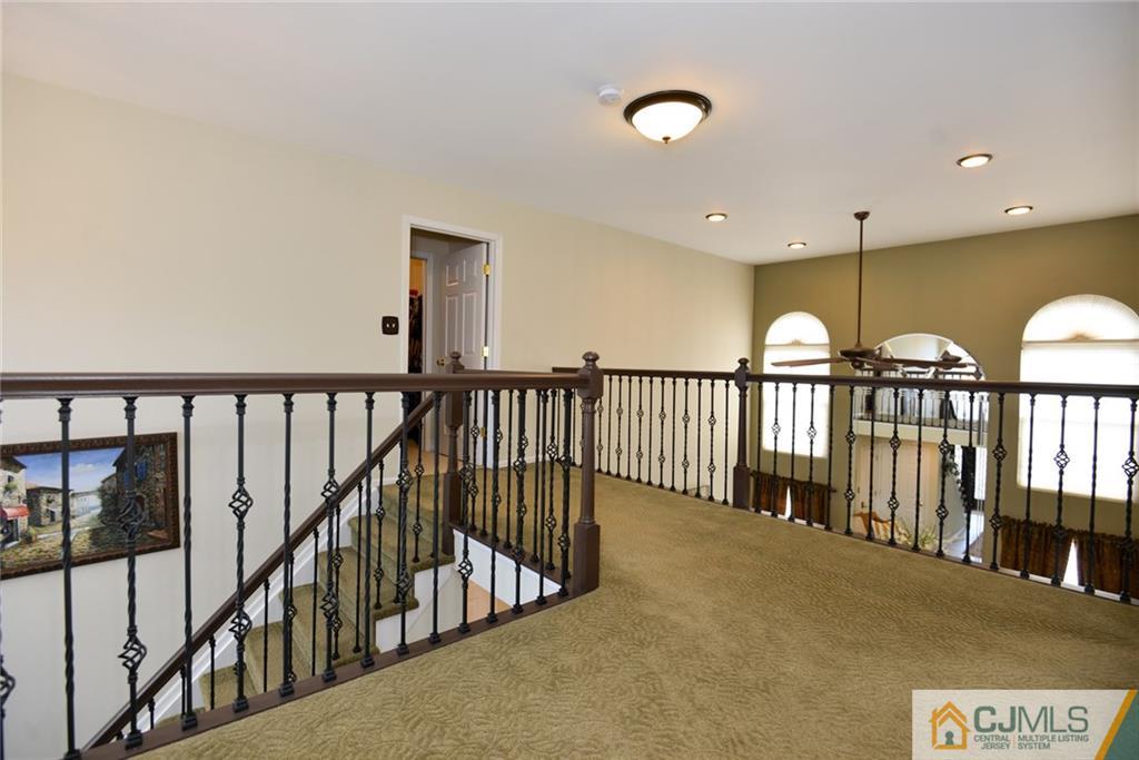 135 Disbrow Road Old Bridge, NJ 07747 - Photo 17 of 25 a view of staircase with lots of wooden floor and windows