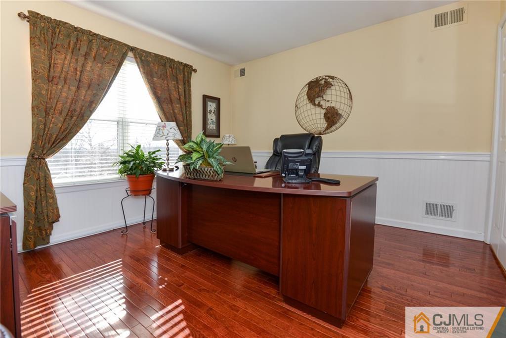 135 Disbrow Road Old Bridge, NJ 07747 - Photo 20 of 25 a living room with furniture and wooden floor