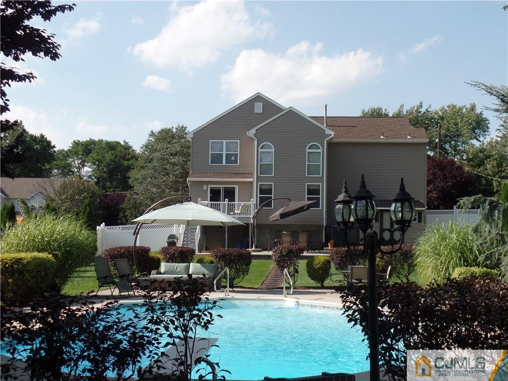 135 Disbrow Road Old Bridge, NJ 07747 - Photo 24 of 25 a front view of a house with garden
