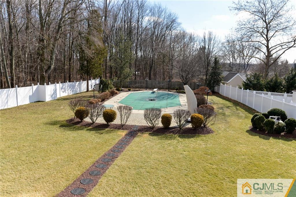 135 Disbrow Road Old Bridge, NJ 07747 - Photo 6 of 25 a view of a swimming pool and lounge chair