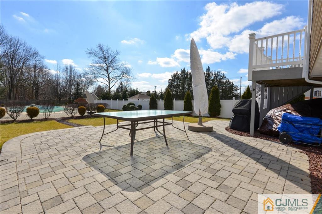 135 Disbrow Road Old Bridge, NJ 07747 - Photo 9 of 25 a swimming pool with outdoor seating and yard
