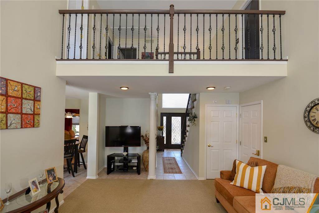 135 Disbrow Road Old Bridge, NJ 07747 - Photo 10 of 25 a living room with furniture and a flat screen tv