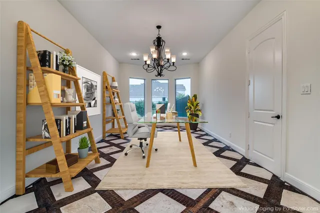 a view of a livingroom with furniture and a chandelier