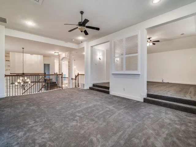 a view of a livingroom with a ceiling fan