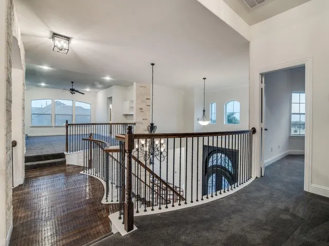 an entryway with a hallway to a livingroom with furniture