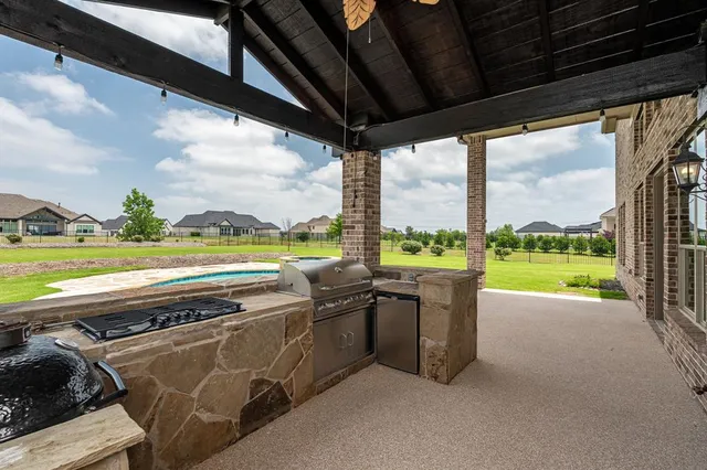a view of a swimming pool and an outdoor seating