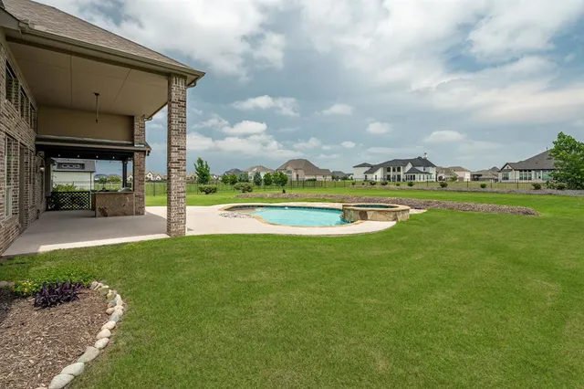 a view of a house with pool porch and garden