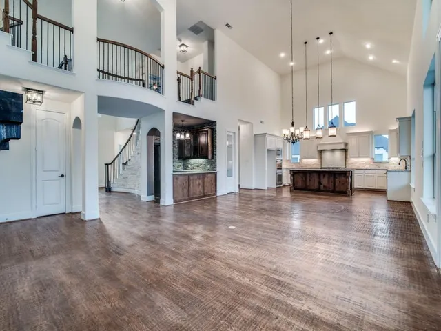 a view of kitchen with furniture and wooden floor