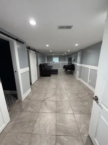 a view of a refrigerator and a sink