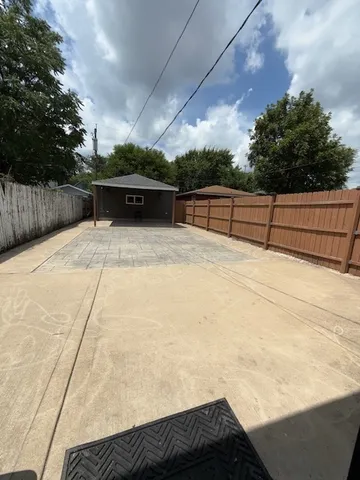 a view of a backyard of the house